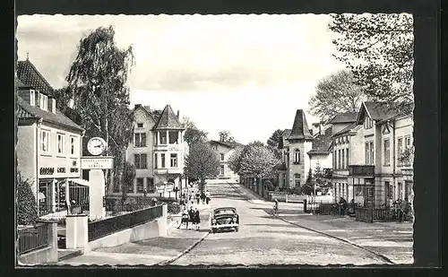 AK Reinfeld, Bahnhofstrasse mit Hotel, Geschäften und Uhrturm