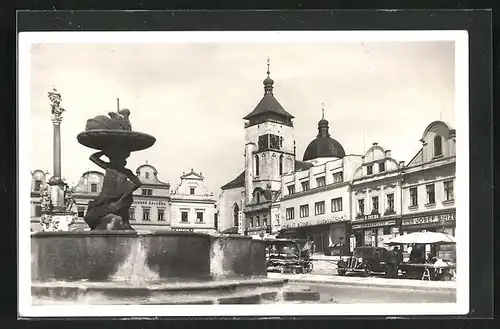 AK Nemecky Brod, Strassenpartie mit Geschäften und Brunnen