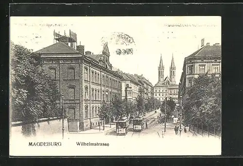 AK Magdeburg, Wilhelmstrasse mit Kirche und Strassenbahn