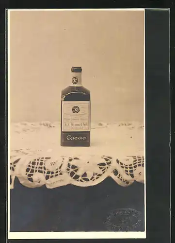 Foto-AK Flasche von J. & C., Kimel AG Kakao auf dem Tisch
