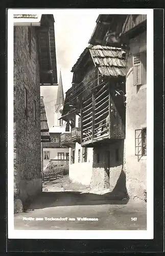 AK Techendorf a. Weissensee, Gasse mit Blick zur Kirche