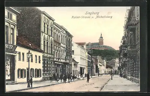 AK Siegburg, Kaiser-Strasse mit Geschäft u. Michaelsberg