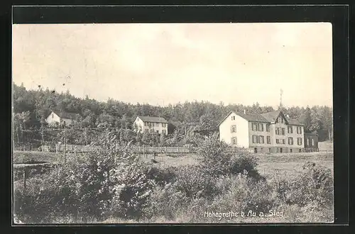 AK Au / Sieg, Gebäudepartie mit Hohegrete am Waldrand