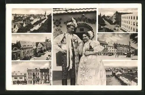 AK Göding / Hodonin, Strassenpartie mit Gebäudeansicht, Denkmal, Paar in Tracht