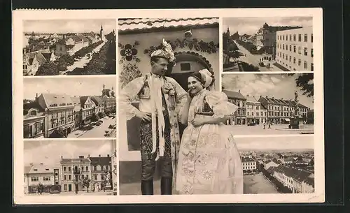 AK Göding / Hodonin, Strassenpartie mit Gebäudeansicht, Denkmal, Paar in Tracht