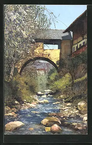 Künstler-AK Photochromie Nr. 2721: Obstblüte in Tirol, im steinernen Flussbett unter dem Übergang