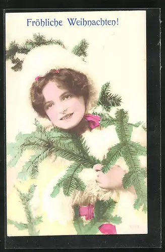 AK Weihnachtsgruss, Lächelndes Mädchen mit Tannenzweigen