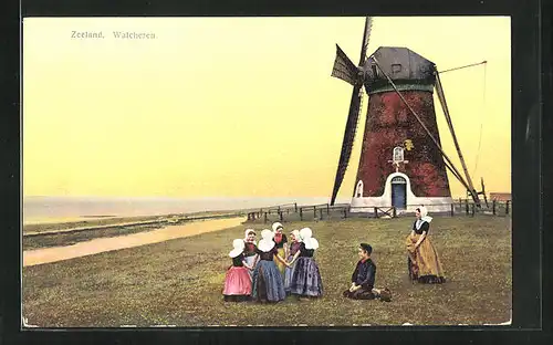 Künstler-AK Photochromie Nr.2934: Zeeland, Walcheren, Mädchen in Tracht vor einer Windmühle