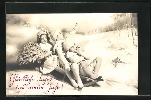 AK Neujahrsgruss, Kinder fahren Schlitten