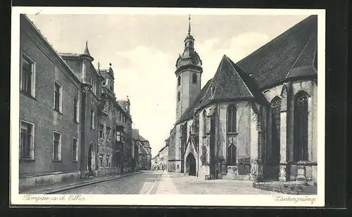 AK Torgau a.d. Elbe, Blick auf Strasse mit Kirche