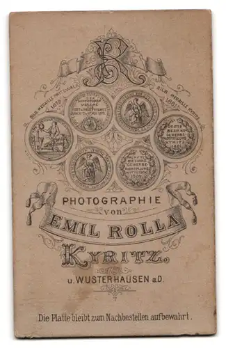 Fotografie E. Rolla, Kyritz, Portrait bildschönes Fräulein mit Dutt in weisser gerüschter Bluse