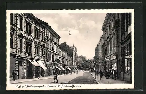 AK Eger, Konrad-Henlein-Strasse mit Geschäften