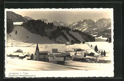 AK Jungholz i. Tirol, Blick auf den eingeschneiten Ort, an der Kirche