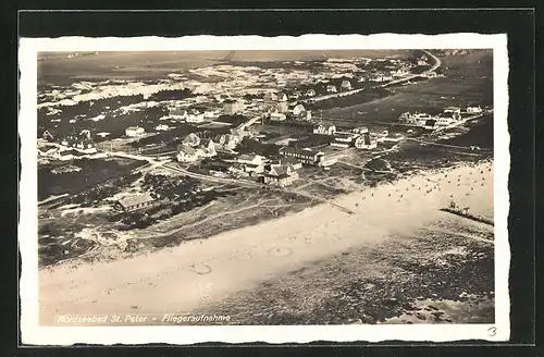 AK St. Peter an der Nordsee, Fliegeraufnahme der Ortschaft und dem Nordseestrand davor