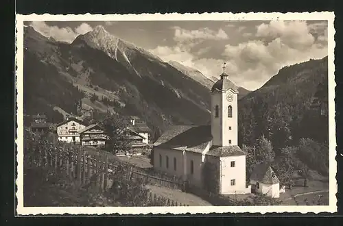 AK Brandberg /Zillertal, Kirche über Garten hinweg betrachtet