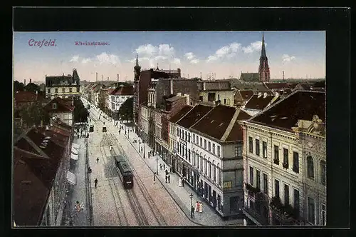 AK Crefeld, Blick auf die Rheinstrasse mit Strassenbahn und Kirche