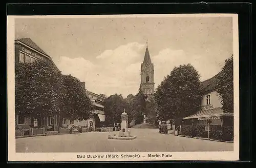 AK Bad Buckow /Märk. Schweiz, Markt-Platz mit Central-Hotel und Denkmal