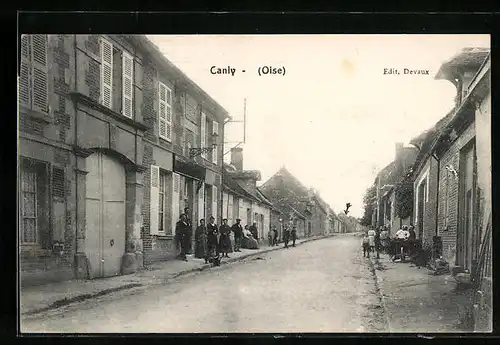 AK Canly, Strassenpartie mit Gebäudeansicht