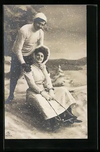 AK Liebespaar mit Schlitten im Schnee