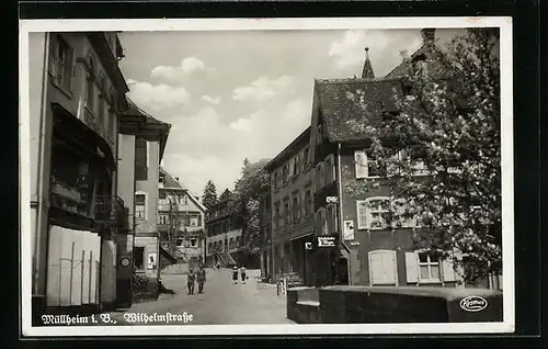 AK Müllheim i. B., Wilhelmstrasse mit Ladengeschäften