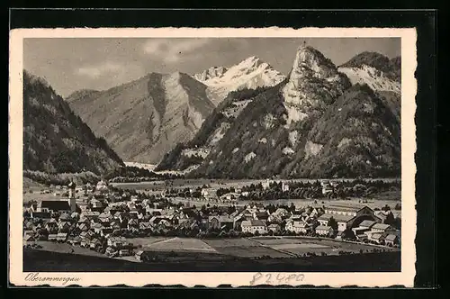 AK Oberammergau, Ortspartie gegen Berglandschaft