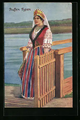 AK Russische Typen, jung Frau im bunten Trachtenkleid am Ufer