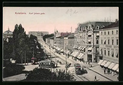 AK Kristiania, Karl Johans gade, Strassenbahnen am Grand Hotel