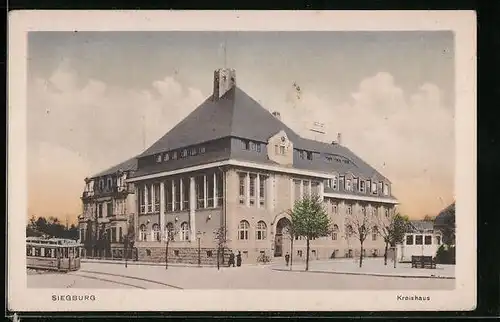 AK Siegburg, Kreishaus mit Strassenbahn und Wolken