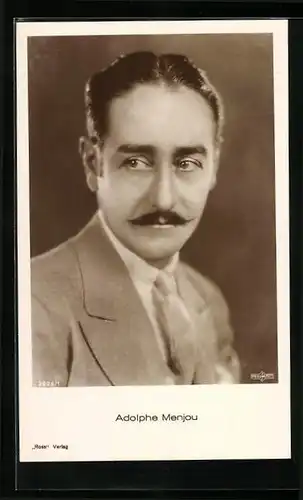 AK Schauspieler Adolphe Menjou im Anzug zur Seite blickend