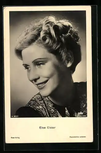 AK Schauspielerin Else Elster mit toller Frisur über ihre Schulter lächelnd