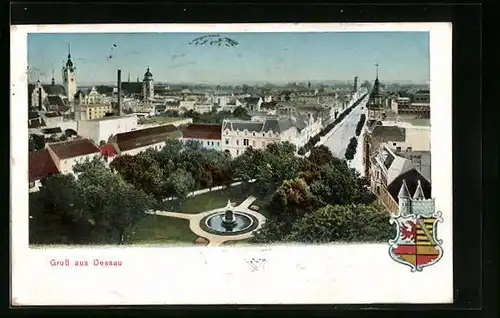 AK Dessau, Teilansicht mit Strassenpartie und Brunnen, Wappen