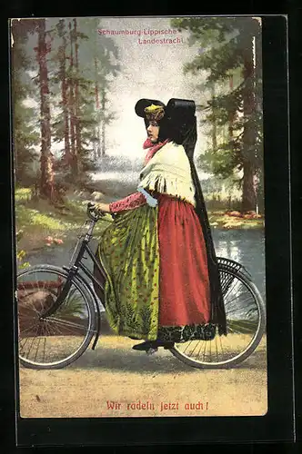 AK Junge Frau auf Fahrrad in Tracht Schaumburg-Lippe