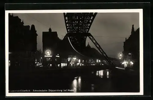 AK Wuppertal-Elberfeld, Schwebebahn Döppersberg mit Hotel Union bei Nacht