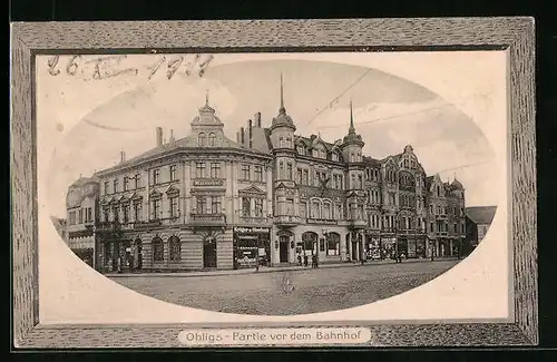 Präge-AK Ohligs, Partie vor dem Bahnhof mit Hotel Kaiserhof und Geschäften im Passepartoutrahmen
