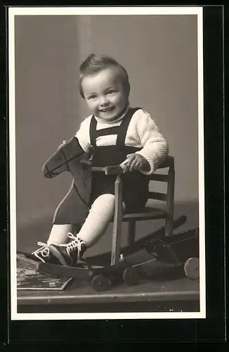 AK Kleiner Junge auf seinem Schaukelpferd