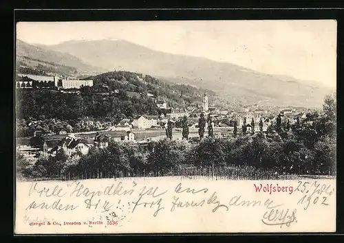 AK Wolfsberg, Ansicht des Ortes inmitten bewaldeter Landschaft