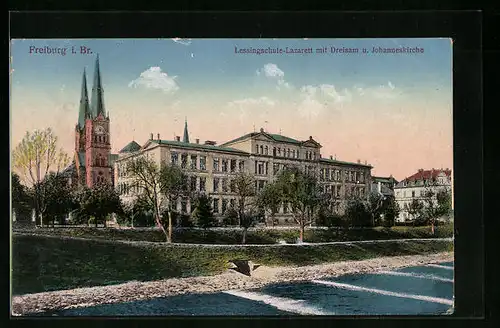 AK Freiburg, Lessingschule-Lazarett mit Dreisam u. Johanniskirche