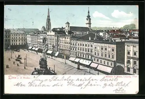 AK Linz a. d. Donau, Strassenpartie mit Geschäften und Brunnen