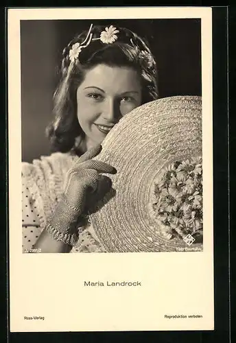 AK Schauspielerin Maria Landrock mit Netzhandschuh und Blumen im Haar einen Hut haltend