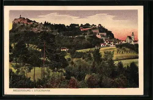 AK Riegersburg, Schloss und Ort im Abendlicht