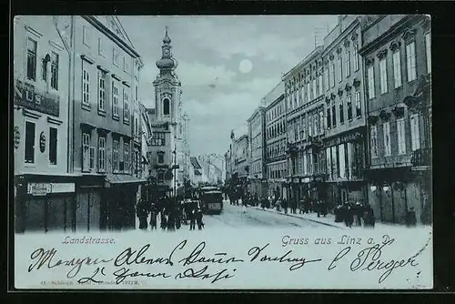 Mondschein-AK Linz a. D., Landstrasse mit Strassenbahn und Passanten