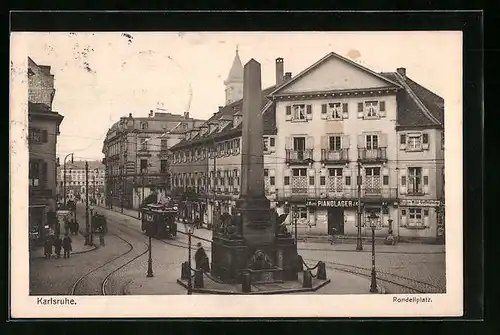 AK Karlsruhe, Rondellplatz mit Denkmal und Strassenbahn