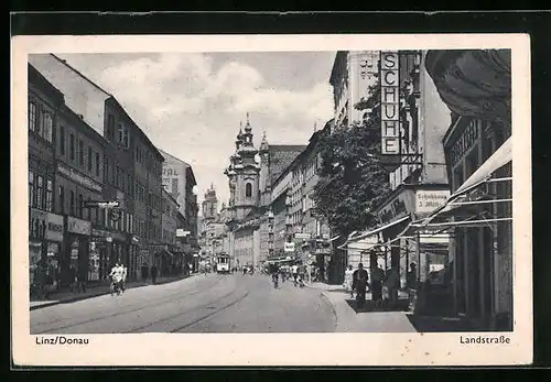 AK Linz a. D., Landstrasse mit Strassenbahn und Passanten