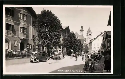 AK Kitzbühel, die Kirchtürme von der Hauptstrasse aus gesehen