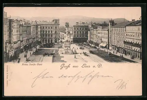 AK Linz a. D., Franz Josef-Platz mit Geschäften und Denkmal