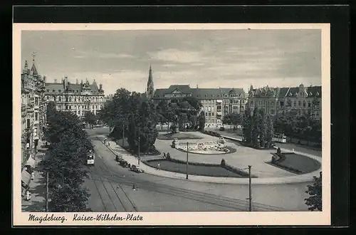 AK Magdeburg, Kaiser-Wilhelm-Platz mit Denkmal und Strassenbahn