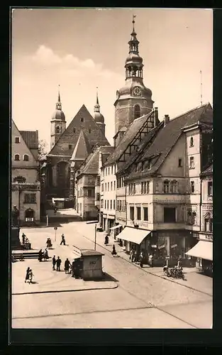 AK Eisleben, Strassenpartie mit Geschäften und Kirche