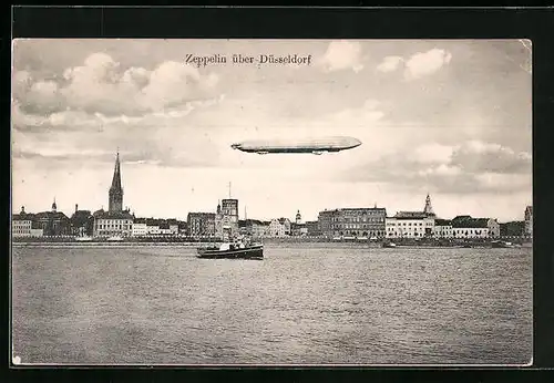 AK Düsseldorf, Zeppelin über dem Rhein mit Panorama der Stadt