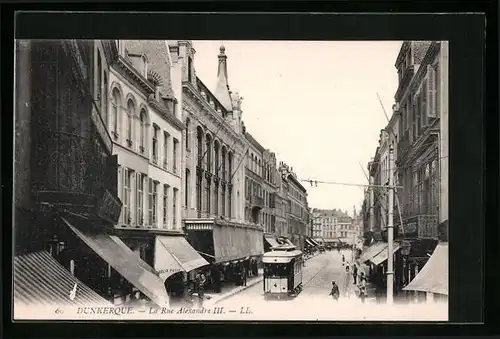 AK Dunkerque, La Rue Alexandre III. Strassenbahn