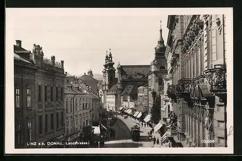 AK Linz a. d. Donau, Landstrasse mit Strassenbahn